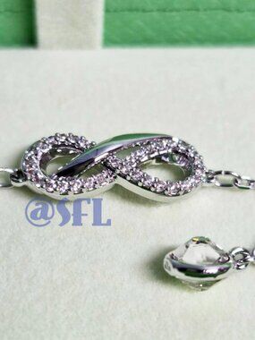 Swarovski Infinity Bracelet Silver Tone Clear Crystals Rhodium Plated NWT